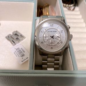 Michale Kors silver oversized watch. Never worn. Needs a new battery.